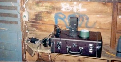 The band camp cabin door alarm, foil and a Walkman rigged above the door
