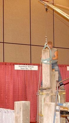 Nick Berg and Thomas Clardy beside the Bovl Blocks concrete tower prototype at the 2003 PAB conference